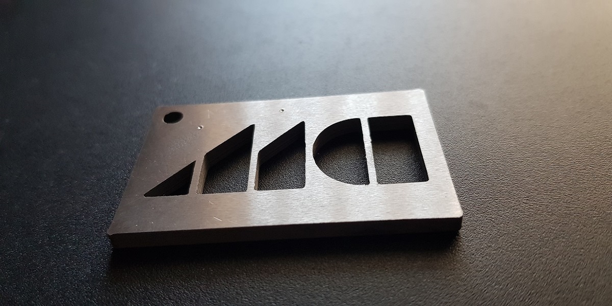 Metal 3D printed sample with DM logo